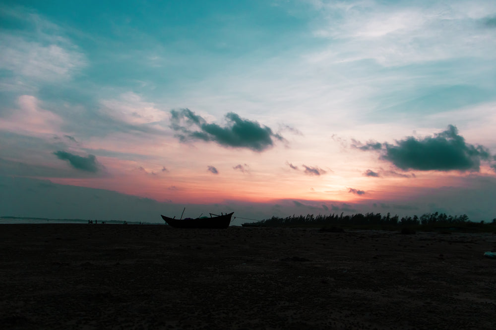 pastel skies over grounded boats