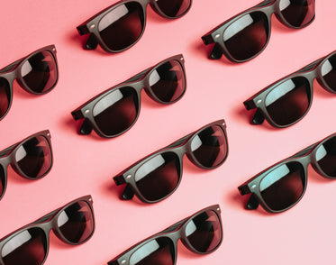 pattern of black sunglasses on pink