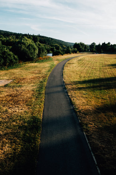 paved road through a open field