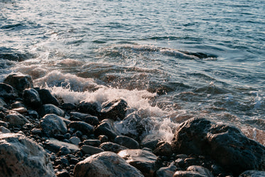 pebbled beach with waves crashing