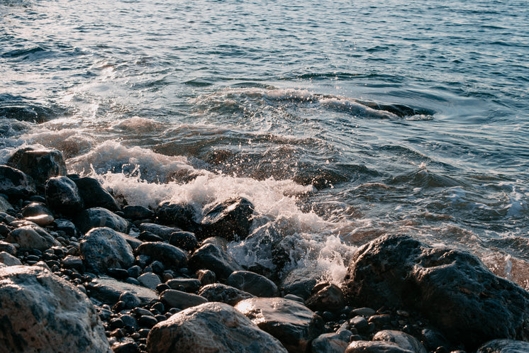 pebbled-beach-with-waves-crashing.jpg?wi