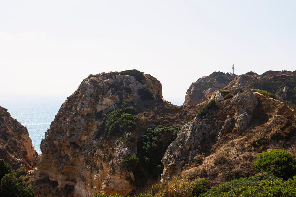 peeking through the cliffside to the sea