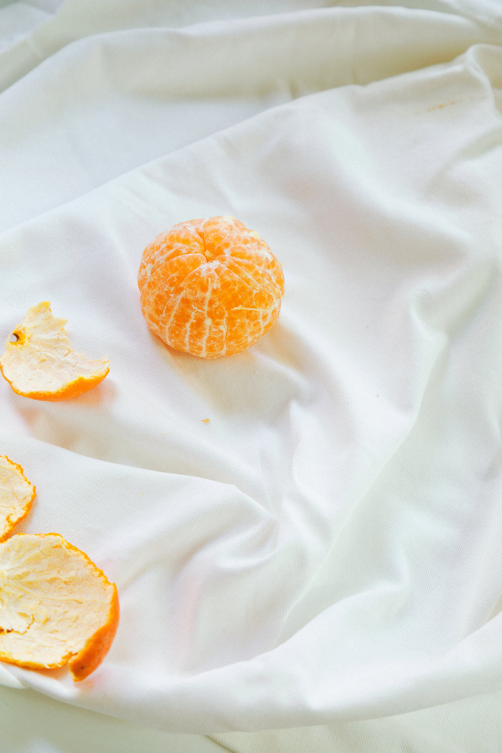 peeled orange on cloth