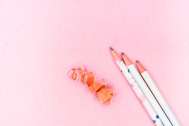 pencils and shavings on pink paper