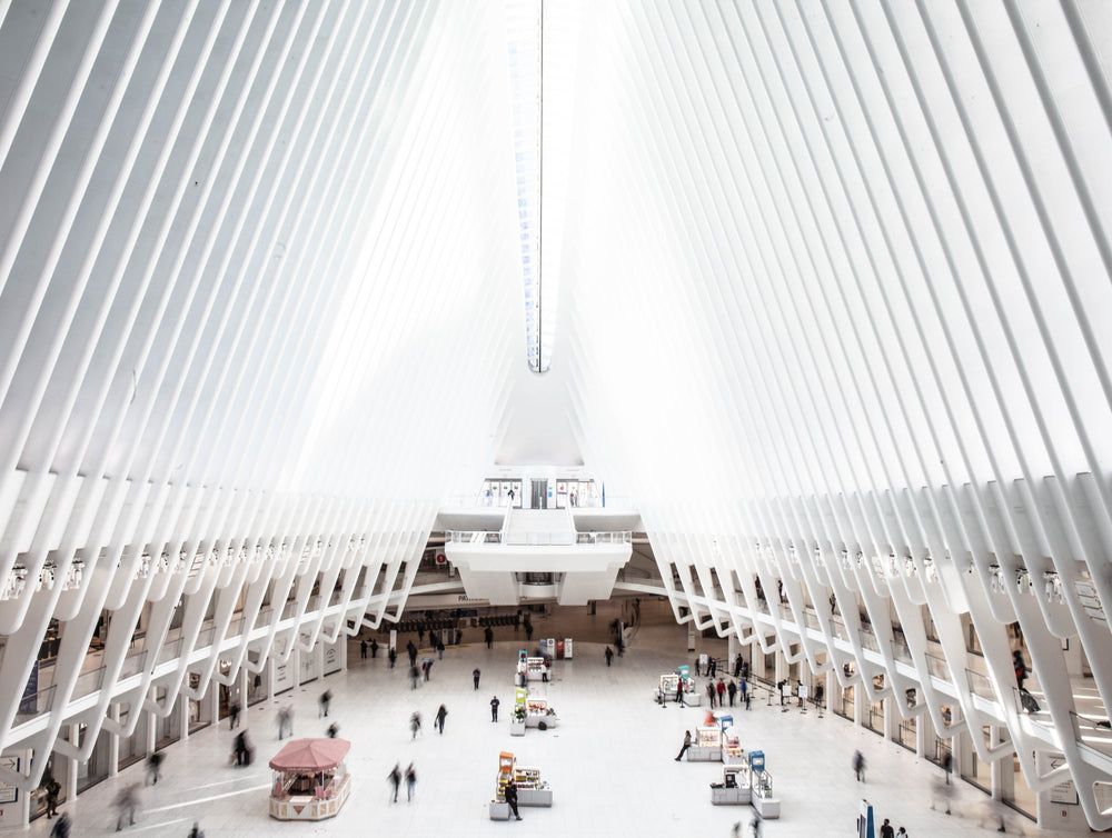 people pass by walking through the oculus in new york