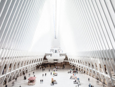 people pass by walking through the oculus in new york