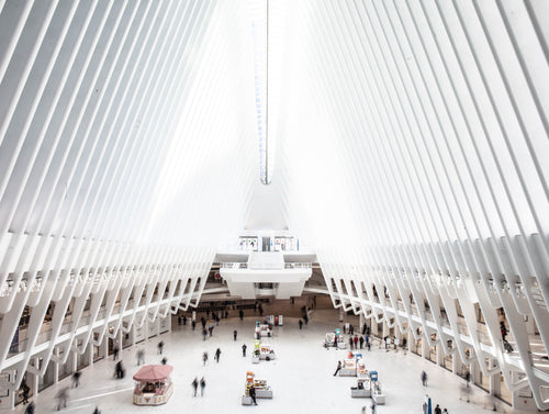 people pass by walking through the oculus in new york