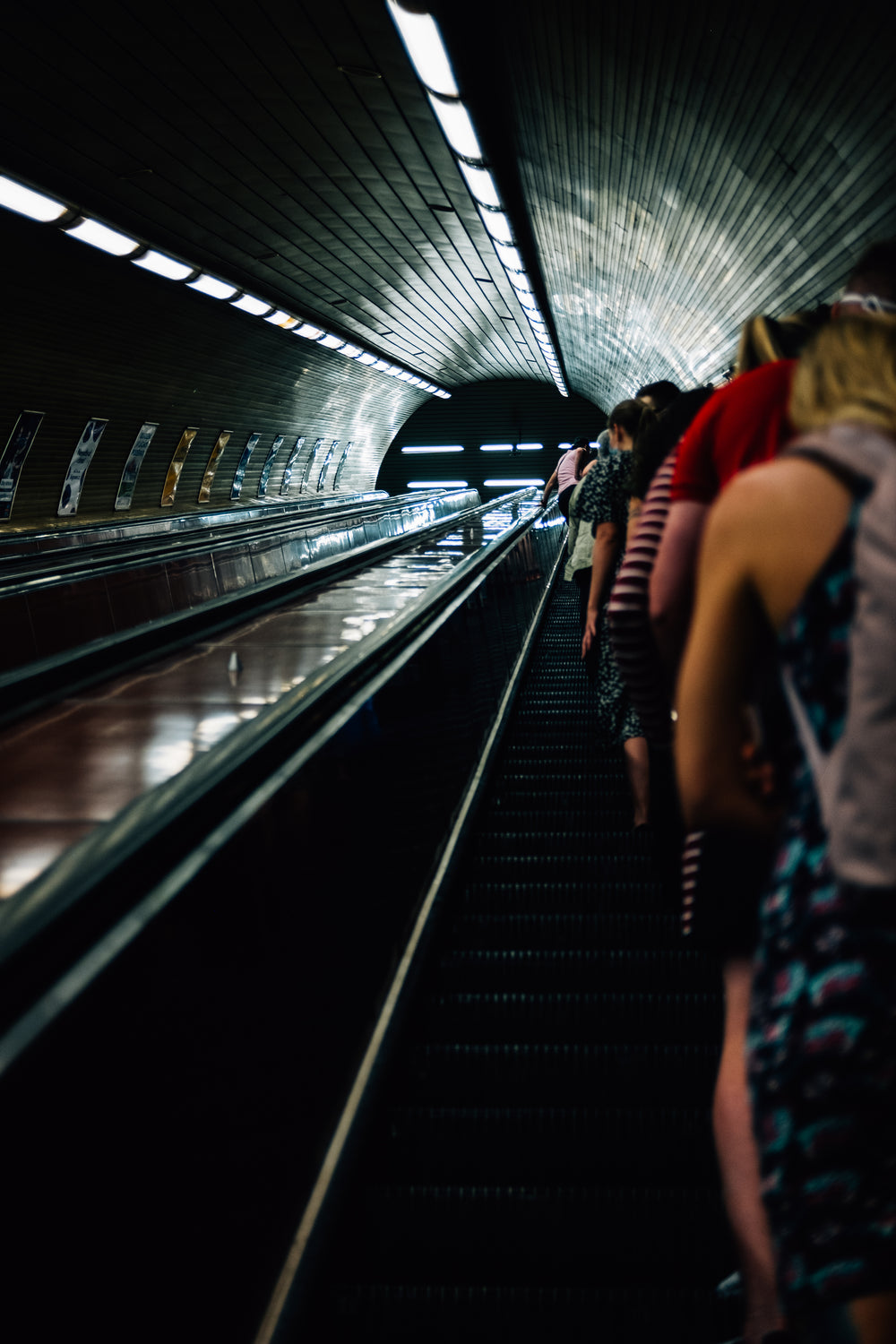 people take an escalator up