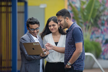 people work together on laptop