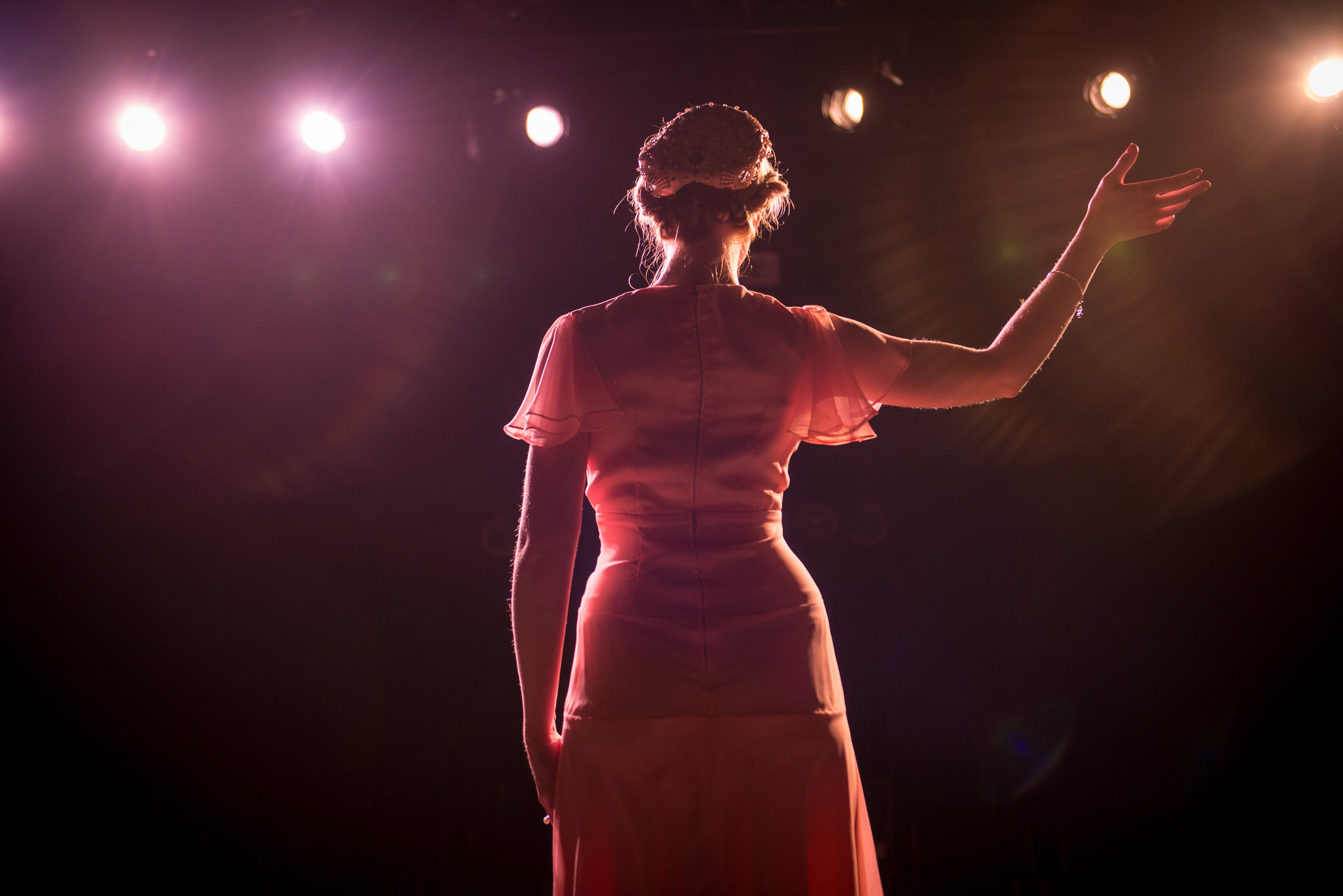 Performer On Stage In Theater Lights