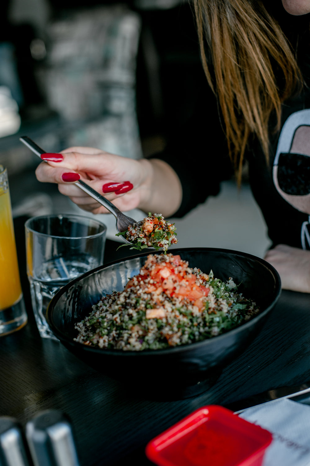 person enjoys a quinoa salad