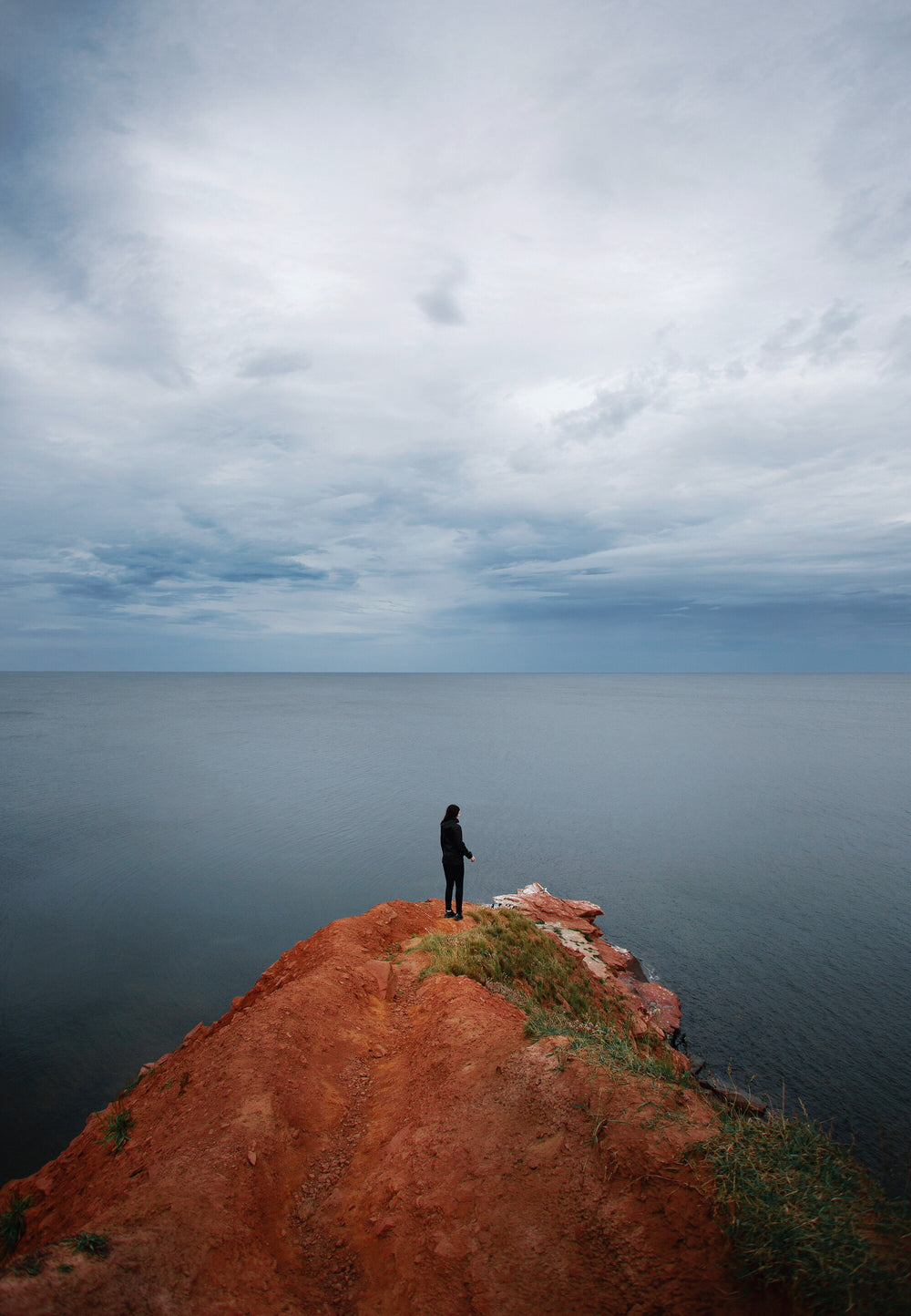 person faces the sea