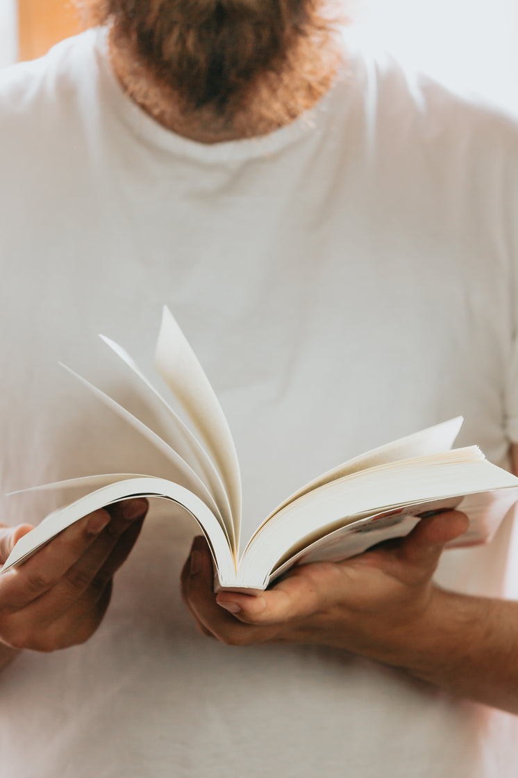 person-holds-a-book-and-flips-through-th