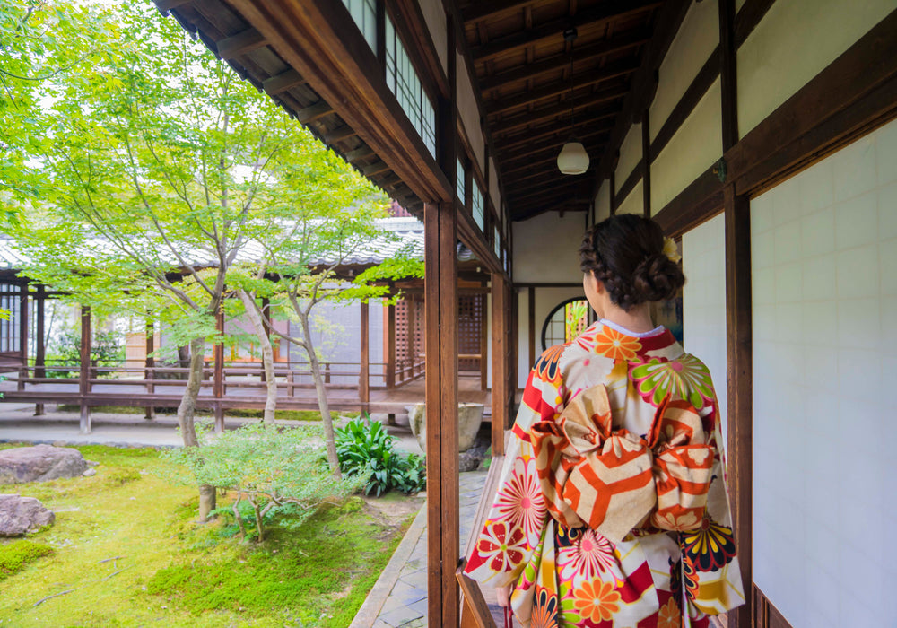 person in kimono faces away from the camera