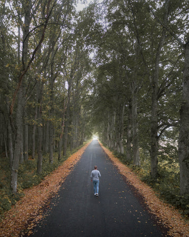 person in the middle of a green archway