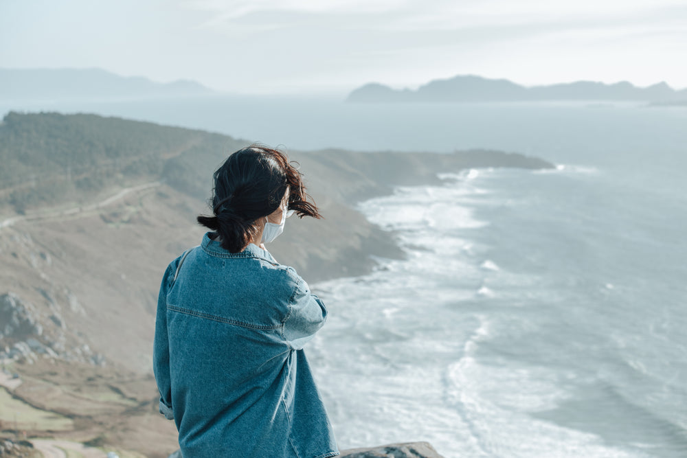 person looks out towards an ocean view