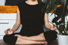 person sits in a calm meditation pose