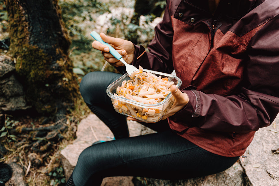 Browse Free HD Images of Person Sits On A Rock Outdoors And Eats Pasta ...