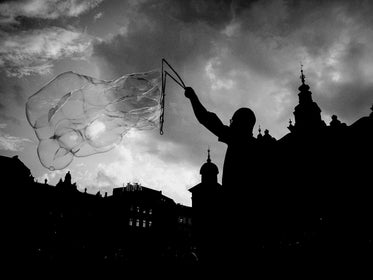 person uses string to create a huge bubble