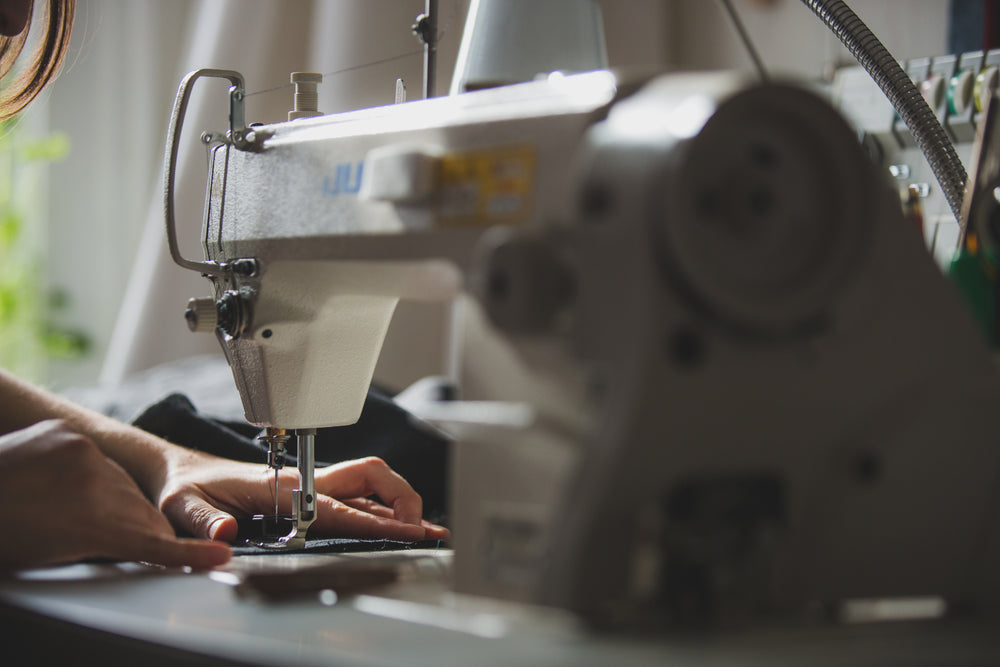 person using sewing machine