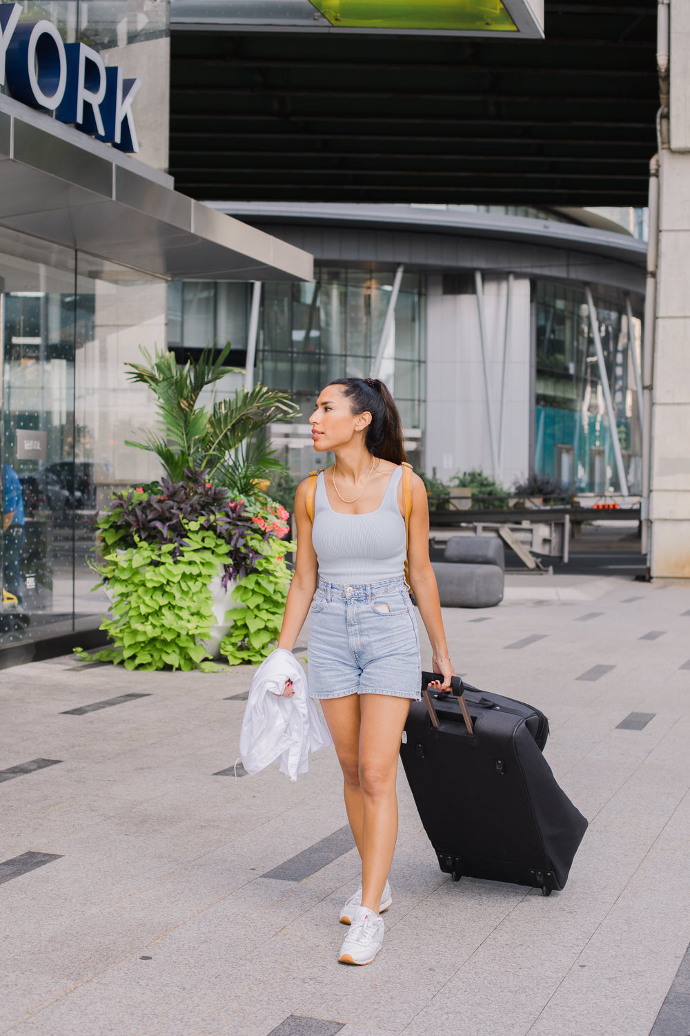 person walking with a large suitcase