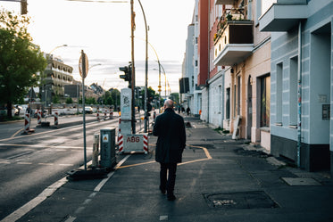 person walks a quiet city street