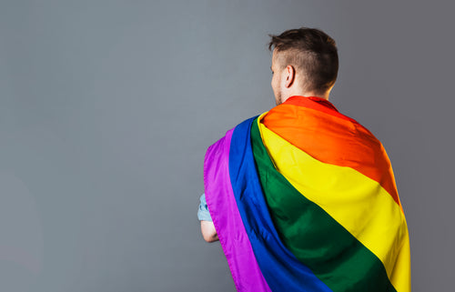 person wearing rainbow pride flag