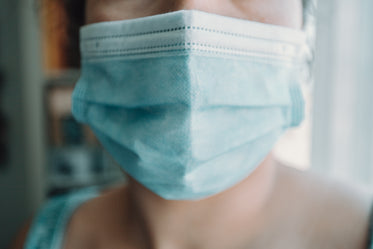person wearing surgical mask close up