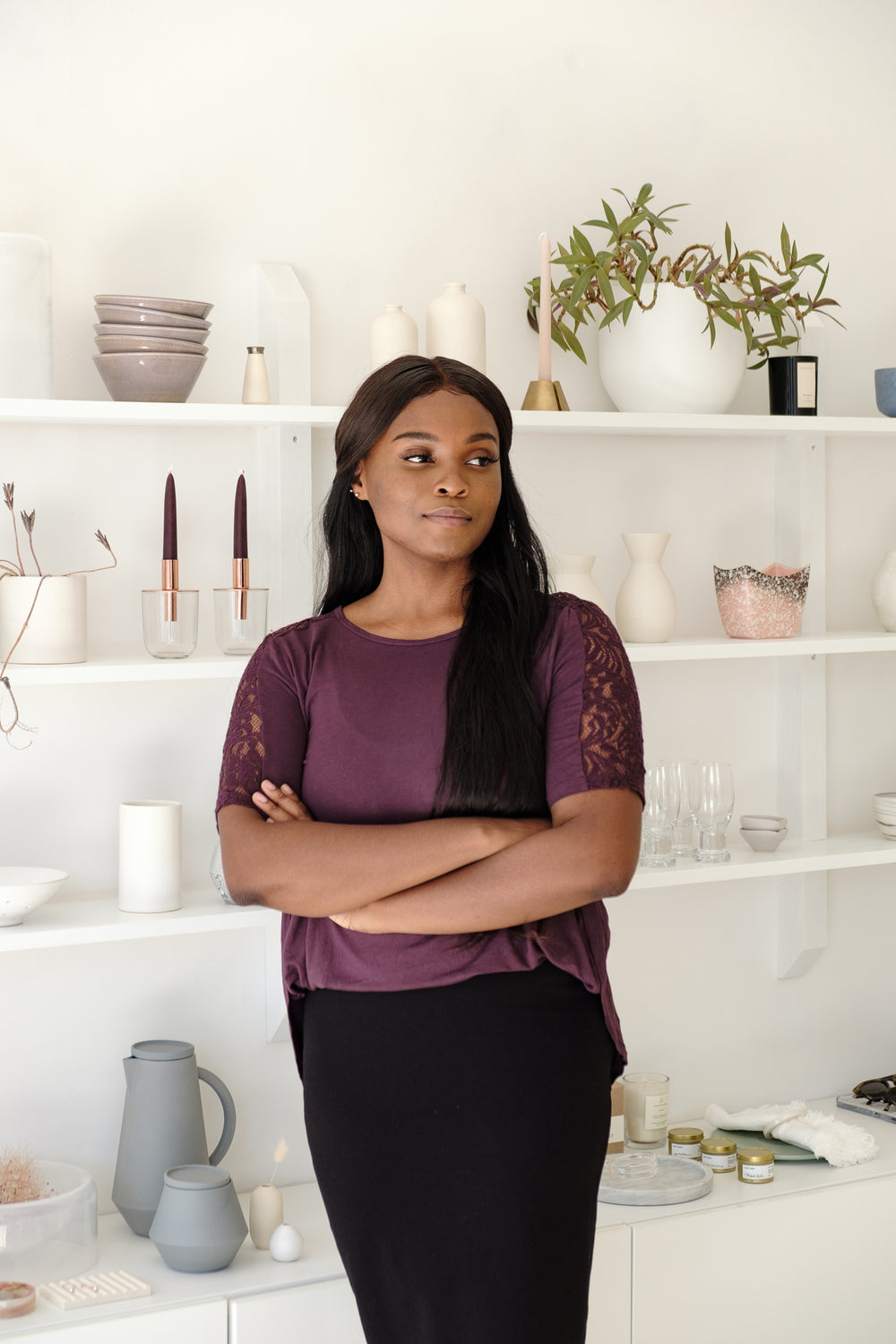 person with crossed arms standing