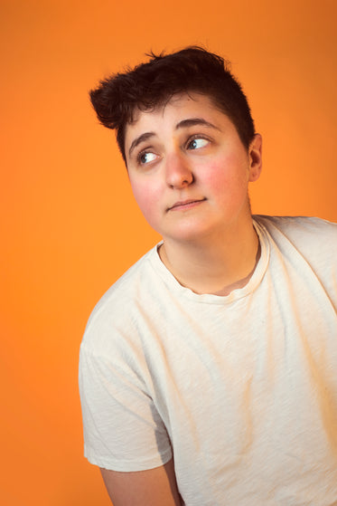 person with short hair giving casual side eye