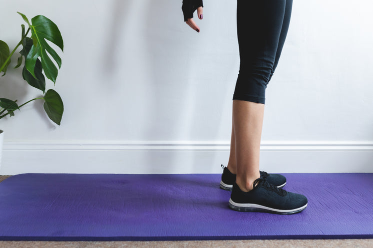 Persons Legs Stand On Purple Yoga Mat