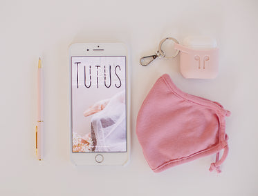 phone and travel flatlay of items