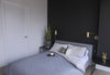 photo of a bedroom with black and gold design