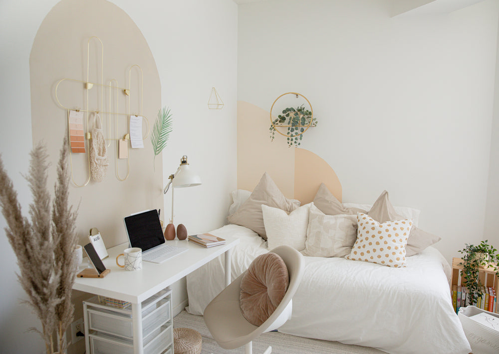 photo of a desk and white corner seating area