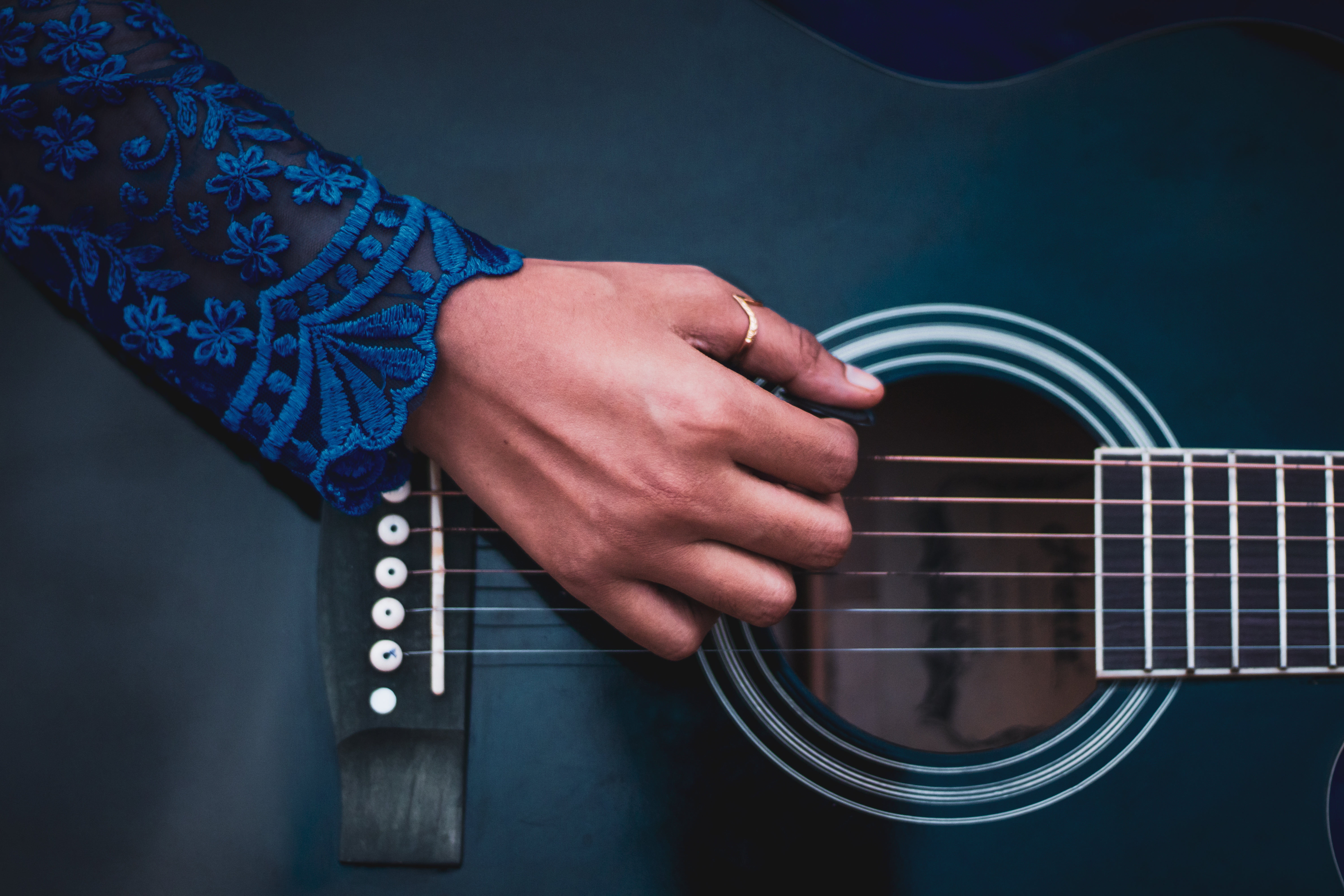 Photo Of A Hand About To Play The Guitar