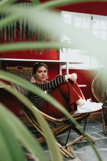 photo of a person sitting in a red room