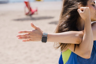photo of a person stretching with a smart watch on