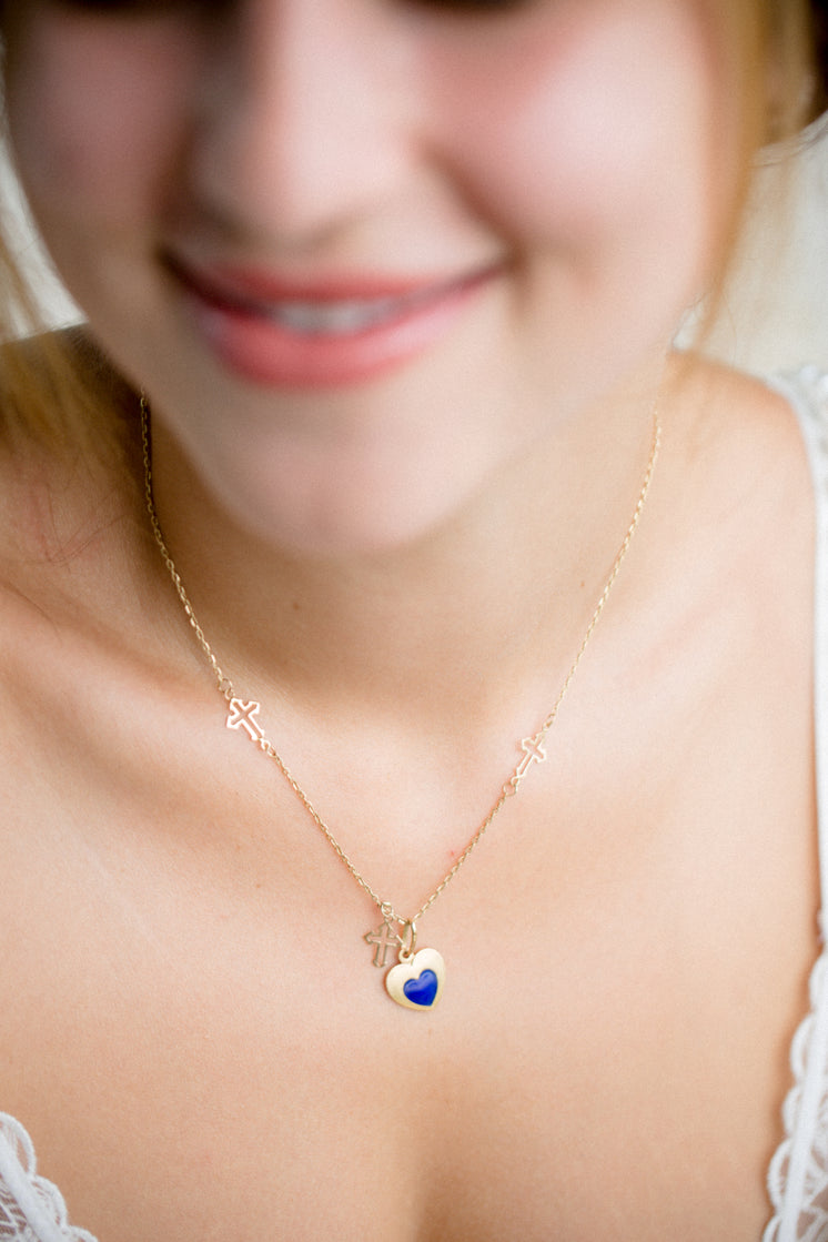 Photo Of A Persons Neck With A Gold Necklace