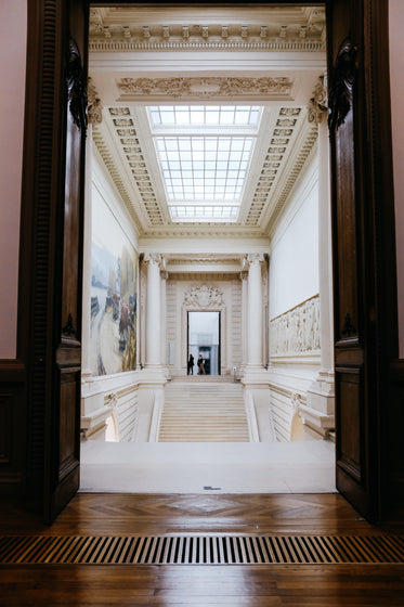 photo of a white hall with a ceiling skylight