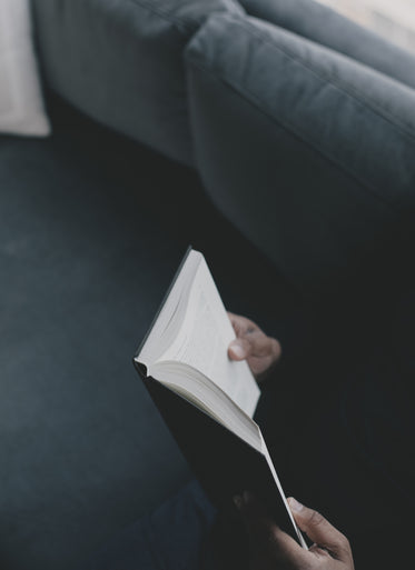 photo of hands holding a hardcover novel