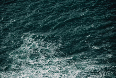 photo of waves in dark blue water