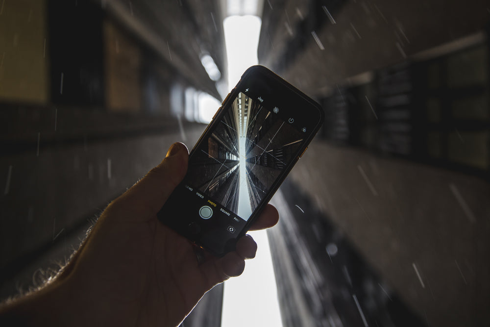 photo up through skyscrapers