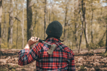 pig tailed camper holding hatchet