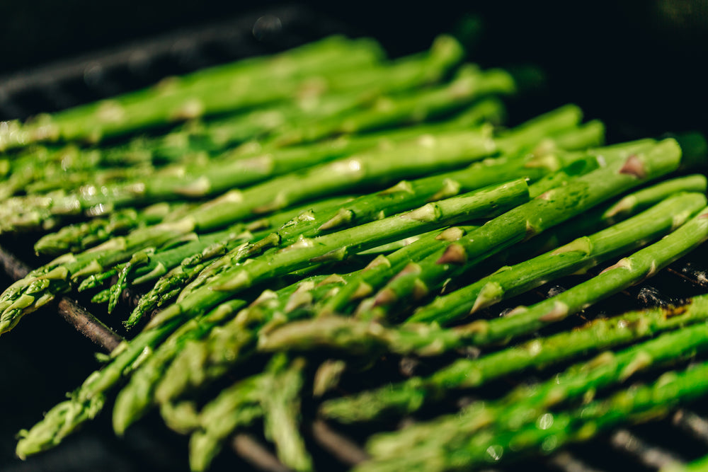 pile of asparagus on a bbq