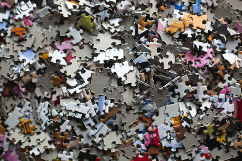 piled puzzle pieces on table