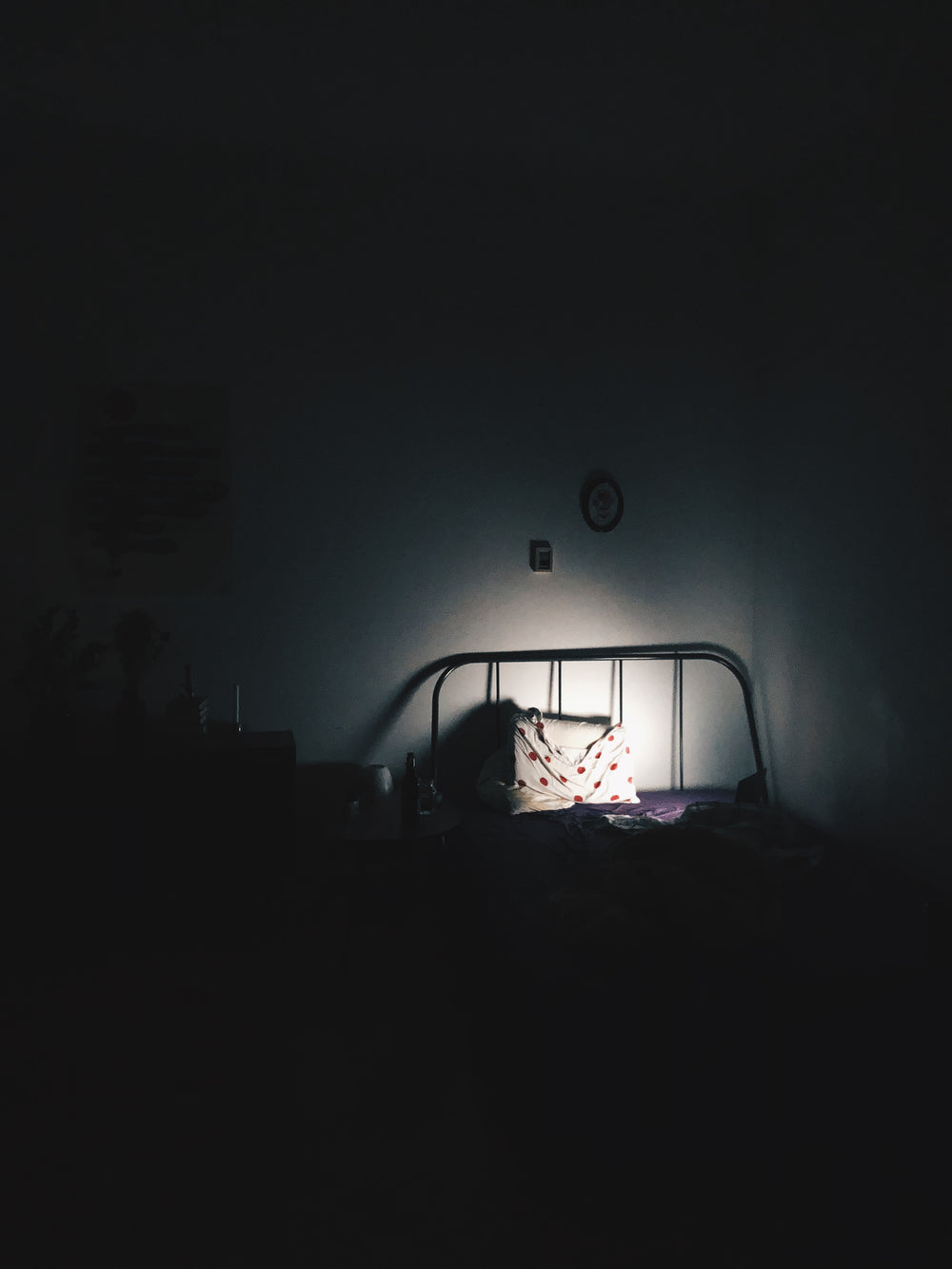 pillow on bed in a dark room