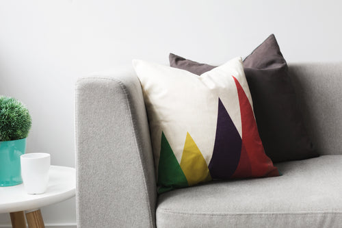 pillows on grey couch