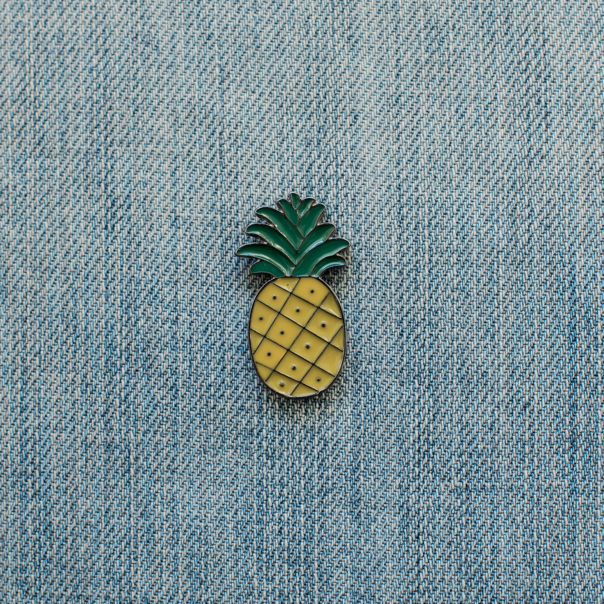 pineapple enamel pin on denim