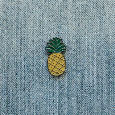 pineapple enamel pin on denim