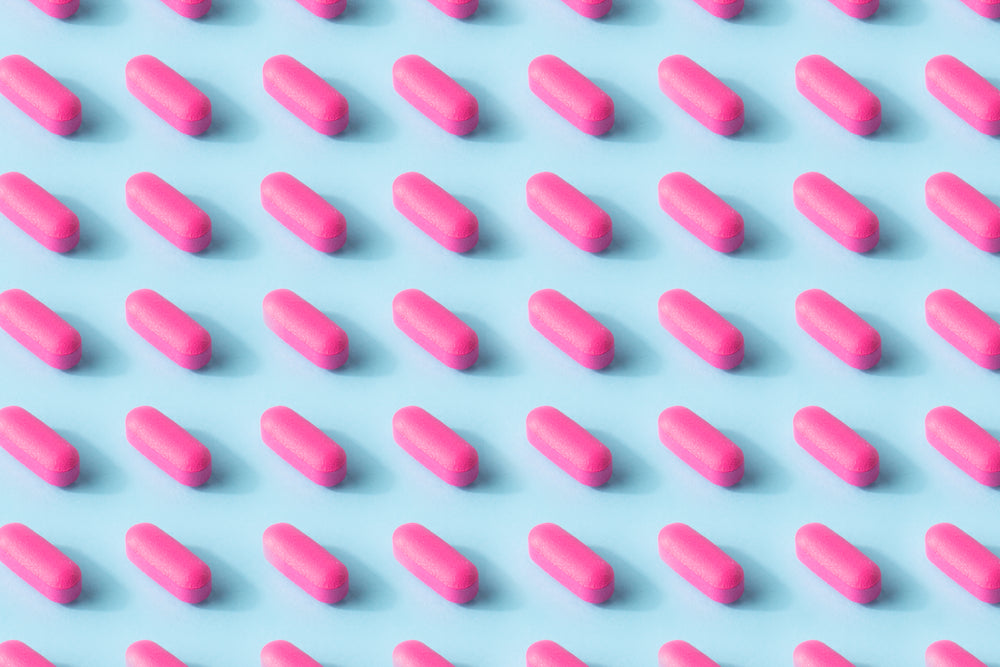 pink pill pattern on a baby blue surface